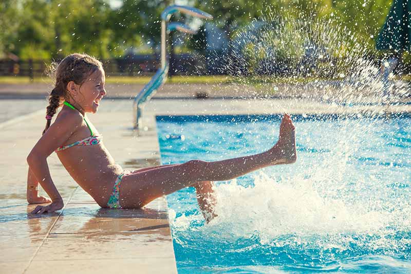 Girl Playing By The Pool