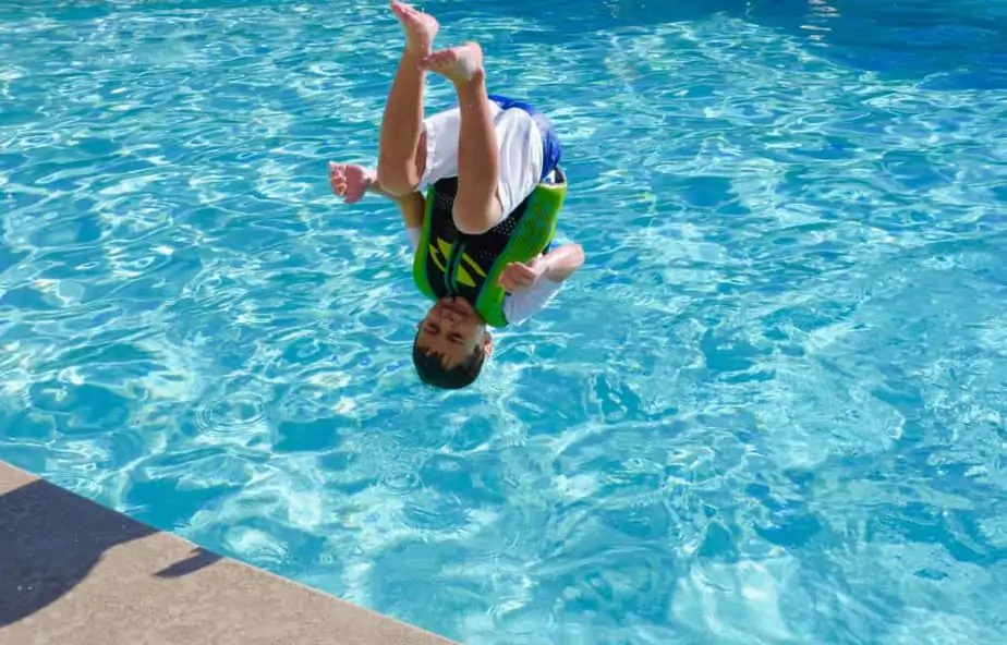Man's jump in a swimming pool
